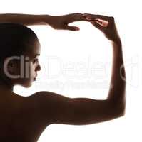 Silhouette of femininity. Graceful nude woman posing against a white background.