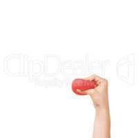 Crushing out all that stress. Cropped view of a womans hand squeezing a stress ball against a white background.