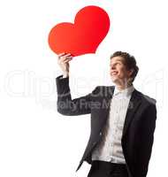 I have only one thing on my mind.... A young man holding a heart symbol in front of a white background.