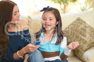 I love this song. Cute little girl listening to music with her mother.