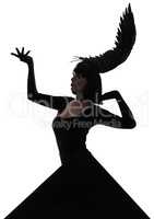 Strike a pose. Shot of a young woman wearing a wing-shaped, feathered headpiece with a black triangle graphic.