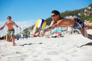 Mine. Shot of a beach volleyball game on a sunny day.