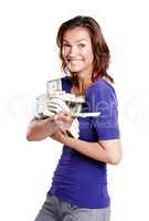 My winnings. Side view of a woman in her mid-30s looking excited while holding stacks of paper currency.