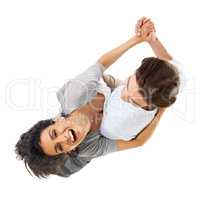 He know how to blow her away. A multi-ethnic couple dancing isolated on a white background - high angle view.