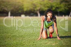 Set your goals, then sprint towards them. Shot of a sporty young woman exercising outdoors.