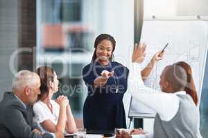 Sharing some constructive feedback. Cropped shot of a businesswoman giving a presentation to her colleagues in a boardroom.