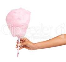 Your sweet tooth is tingling. Cropped image of a woman holding some delicious candy floss while isolated on white.