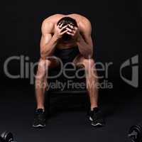 Turn a setback into a comeback. Studio shot of a muscular bare-chested young man isolated on black.