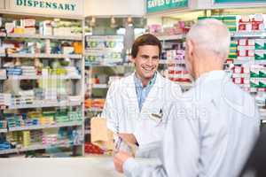 This is exactly what you need. Cropped shot of a handsome young male pharmacist helping a customer in the pharmacy.