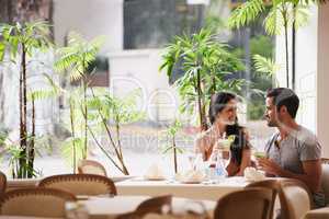 Table for two. A couple on a romantic date at a fine dining restaurant.