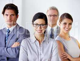 Theyre a team thats headed for success. Confident team of businesspeople standing together - portrait.