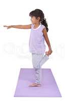 Her mother introduced her to yoga. An adorable little girl practicing yoga.