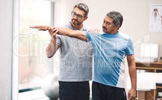 It all starts with a stretch. Shot of a senior man going through rehabilitation with his physiotherapist.