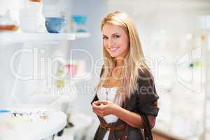 In love with shopping. Stunning young woman at the shops and browsing.