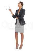 Shes got both feet firmly on the ground in business. Studio shot of a young businesswoman isolated on white.