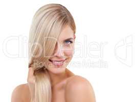 Blonde and beautiful. Studio portrait of a young woman with long blonde hair.