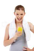 Life is juicy. Studio shot of a pretty teenage girl holding a glass of orange juice.