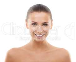 Pampered and happy. Beautiful young woman smiling while isolated against a white background.