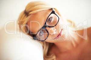 Beautiful and homely. Shot of a gorgeous young woman relaxing at home.