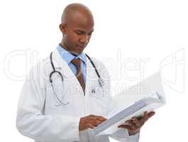 Hes got access to all your medical records. A young doctor looking over your medical paperwork.