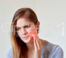 That looks like it hurts. Cropped shot of a young woman experiencing a toothache highlighted in glowing red.