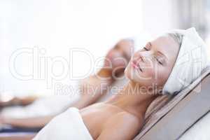 Theres nothing better than a day at the spa. A beautiful young woman relaxing at the beauty spa.