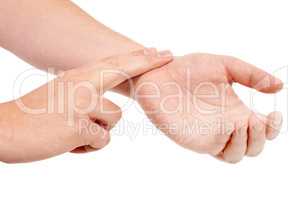 The correct way to check a pulse. Male hands taking a pulse rate against a white background.