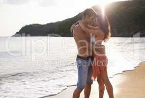 Our tans will fade, but the memories will last forever. A young couple on a calm and tranquil beach.