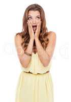 Im amazed at this sight. Attractive young woman standing with a shocked expression on isolated background.