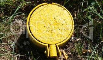 yellow gas hatch  at dry sunny summer day