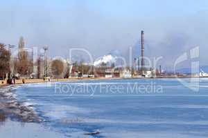 Bodo is in sight.... Shot of industrial buildings along the waters edge.