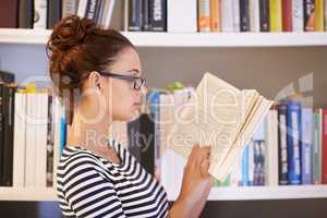 Nothing beats a good book. A young woman reading a book.