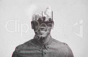 Dont allow anyone to pollute your mind. Multiple exposure shot of a refinery superimposed over a young mans head.