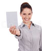 Please, take my card. Studio portrait of an attractive young woman holding up a small blank sign isolated on white.