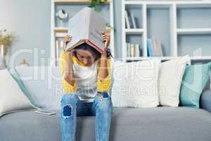 Stressing about finals. Shot of a young female student studying at home.