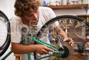 Fixing things is what I do best. Shot of a confident young bicycle repairman.
