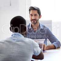 Why should we hire you. Shot of a businessman interviewing a job applicant in an office.