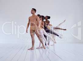 Bated breath at its finest. Shot of a group of ballet dancers practicing a routine in a dance studio.
