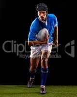 Keep calm and play rugby. Shot of a young rugby player on the field.