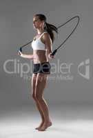 Theres no excuse for skipping a workout. Full length shot of an athletic woman skipping during her daily workout.