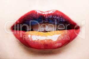 Youll never forget these lips. Cropped shot of a womans multicoloured lips.