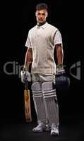 Looking towards that century. A cropped shot of an ethnic young man in cricket attire isolated on black.