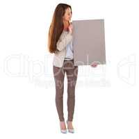 Lets get you noticed. Studio shot of a young businesswoman holding a blank field of tan copyspace.