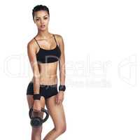 Time to do a set. Studio portrait of a fit young woman in sportswear holding a kettlebell isolated on white.