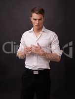 Broody attractiveness. Portrait of a handsome young man against a black background.