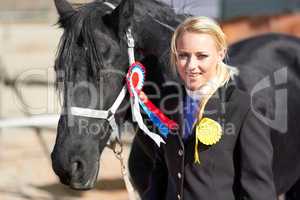 Hes more than just an animal to me. Shot of a beautiful young woman standing next to her horse.