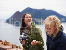 You shouldve seen your face in that last shot. A shot of two young women laughing on the side of the road during their trip.