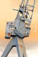 A photo of a hoisting crane. A photo of a hoisting crane.