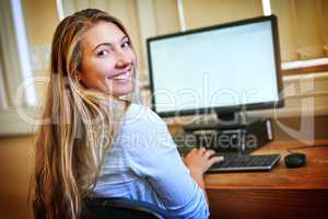 Sourcing all the digital scholarly journals I need for my course. Portrait of a university student working on a computer in the library at campus.