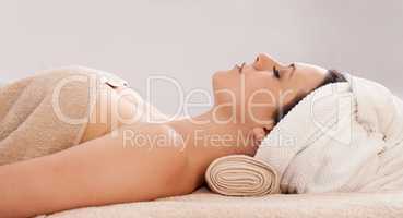 Relaxation and bliss - The perfect spa day. Side view of a gorgeous young woman lying in a day spa.